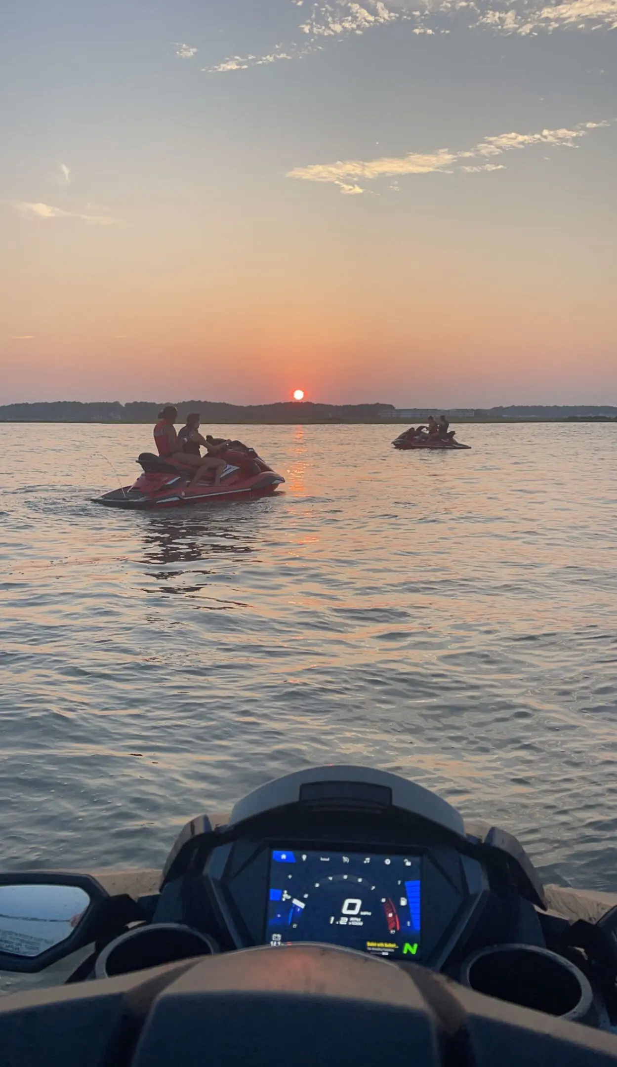 A couple of people on small boats in the water.